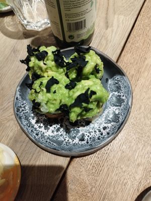 My picture skills are so sad. This one was delicious with zucchini outerior and a huge avocado creme pile on top at Youmiko Vegan Sushi - Hoża in Warsaw