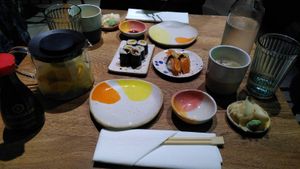 Some of the sushi pieces, which were part of a menu of many different sushi pieces. Left: pot with lemon-ginger tea. at Youmiko Vegan Sushi - Hoża in Warsaw