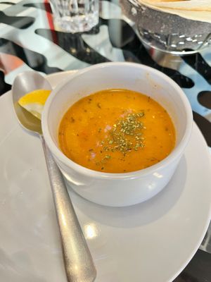 Lentil soup. Would have been better without the oil, but nice flavour and great add with the lemon wedge  at Le Mezze du Chef - Menilmontant in Paris
