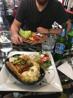 Kumpir in front & cig Kofte plate behind at Le Mezze du Chef - Menilmontant in Paris