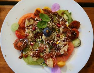 Colourful tomatoes with hemp nut zarella, salad and fig balsamico at Alge in Moenchengladbach