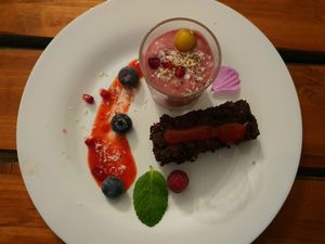 Hibiscus blossom lemon cream with brownie and strawberry rose sauce at Alge in Moenchengladbach