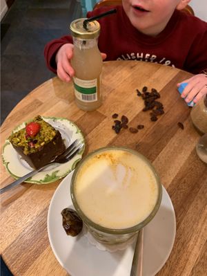 Sweet potato brownie and golden chai. Free raisins for the little ones. at Sencha Lunchstore in Alkmaar