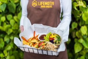 Rainbow wrap with thai peanut sauce and baked vegetable fries at Lifemotiv in Warsaw