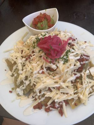 Chilaquiles with salsa verde and chorizo  at The Pitted Date in Playa Del Carmen
