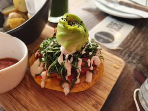 Half of a bagel sandwich at The Pitted Date in Playa Del Carmen