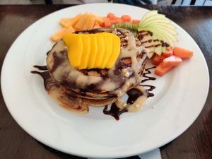 Hot cakes with choco monkey topping at The Pitted Date in Playa Del Carmen