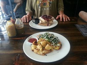 Vegan omelette with roasted potatoes and waffles with berries at The Pitted Date in Playa Del Carmen