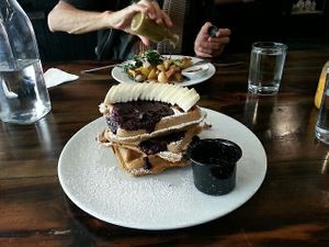 Waffles with banana and berries at The Pitted Date in Playa Del Carmen