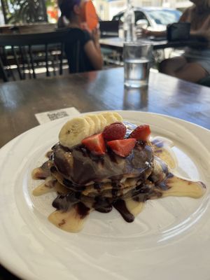 These pancakes had banana also layered and I swear the quality was like homemade from scratch!  at The Pitted Date in Playa Del Carmen