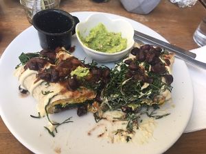 Breakfast burrito- always forget to take pics before I start. This was straight-up delicious. at The Pitted Date in Playa Del Carmen