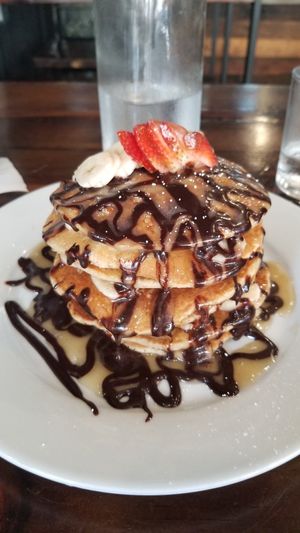 The gluten-free hotcakes with choco monkey topping...deeeelicious! at The Pitted Date in Playa Del Carmen