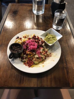 Chilequiles with vegan egg and vegan chorizo at The Pitted Date in Playa Del Carmen