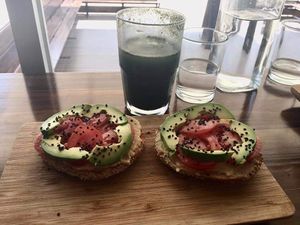Bagel and a green juice 🥑💚 at The Pitted Date in Playa Del Carmen