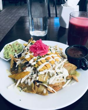 Chilaquiles with vegan egg and green sauce at The Pitted Date in Playa Del Carmen