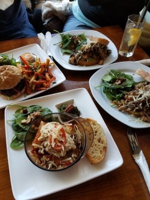 a lasagna, two Kawai plates, and a black bean/quinoa burger at Kaffi Vinyl in Reykjavik