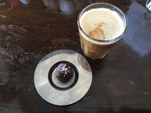 Coconut milk latte and a little bounty ball, couldn't have asked for a better snack  at Kaffi Vinyl in Reykjavik