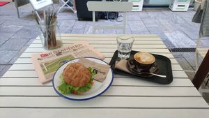 Avocado sandwich, cappuccino with a glass of water and Der Standard - How could this not be a great start of the day  at Ginko - Greenhouse in Graz