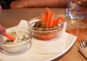 free tapas (green olives, carrots, vegan cream cheese) at Hicuri in Granada