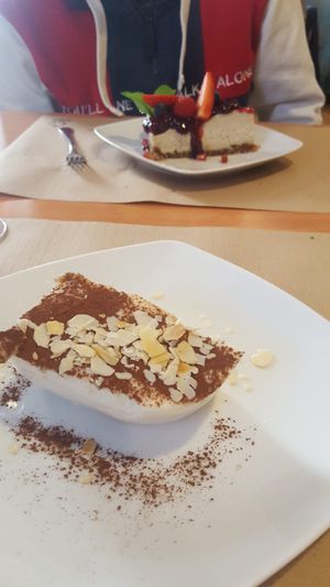 Desserts -- almond tiramisu and cheese cake at Hicuri in Granada