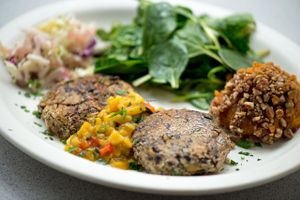 Vegan Black Bean Cakes with mango salsa, sauteed spinach and mashed sweet potatoes. at Wishbone Restaurant in Chicago