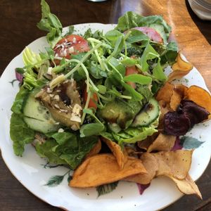 Sourdough open toasted sandwich with Avocado and salad.  Vegetable chips on the side.  at Seaside Kitchen in Margate