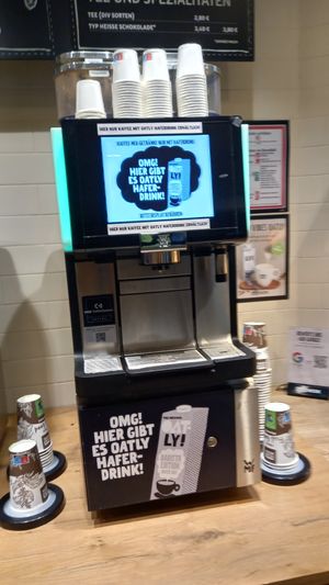 coffe machine with oat milk (🚨the cocoa powder contains milk powder, so it's never vegan🚨) at backWERK - Hauptbahnhof in Berlin
