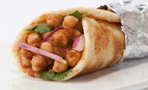 Chickpea Chana wrap, a delish veggie option in a flaky flatbread paratha or made vegan in a flatbread roti or over basmati Indian rice or fresh cut salad. at Bombay Eats - Streeterville in Chicago