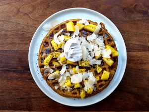 Mango waffles with maple syrup, coconut and and coconut cream at Fruitive - Palmer Alley in Washington