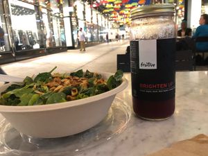 Spicy greens salad + brighten up juice + lovely outdoor seating  at Fruitive - Palmer Alley in Washington