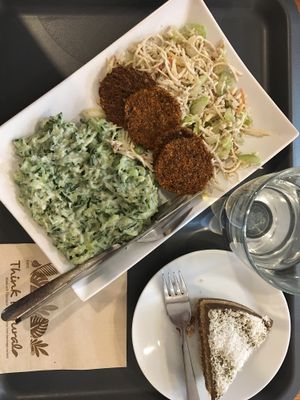 Variations of foods offered as menu and a cake at Veggie Nyers in Budapest