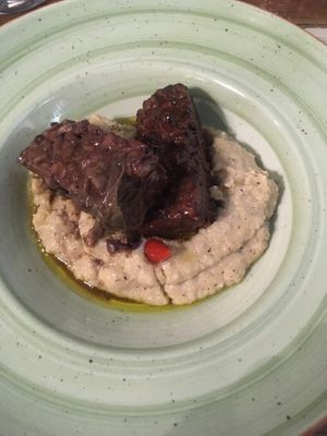 Wine roast tempeh and polenta  at L'Orto Gia Salsamentario in Turin
