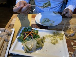 Crespella arrotolata di farina integrale, ripiena d crema di piselli, tofu affumicato, menta, patate e porri  at L'Orto Gia Salsamentario in Turin