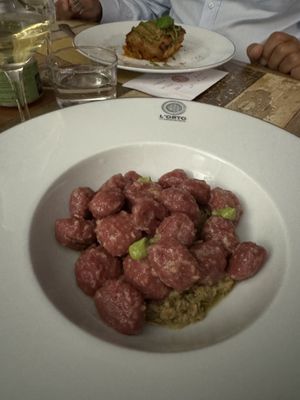 Gnocchi di barbabietola con sugo super top! Ricorda un ragù bianco, ovviamente vegan  at L'Orto Gia Salsamentario in Turin