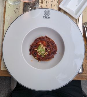First course : tagliatelle, processed with blueberries, and tomato sauce at L'Orto Gia Salsamentario in Turin