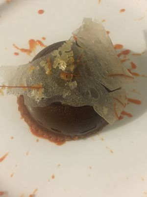 Chocolate sphere with crunchy filling  at L'Orto Gia Salsamentario in Turin