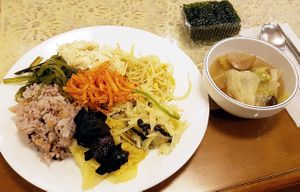 Lunch from buffet featuring silk tofu stew, soy bean sprouts, napa cabbage, potato slices, radish with chili flakes (무생채), soup, nori seaweed (김) etc. at Jeoksubang - 적수방 in Seoul