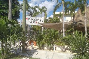 Outdoor streetcorner seating at Burrito Amor in Tulum