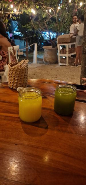 Orange juice and cucumber lime water at Burrito Amor in Tulum