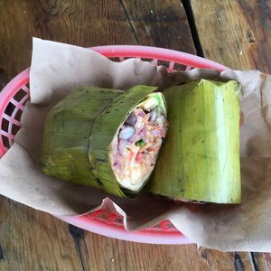 Vegan burrito wrapped in banana leave at Burrito Amor in Tulum
