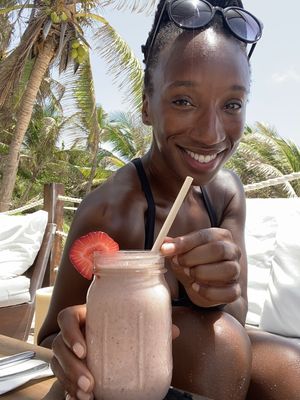 @TierraGoesGreen enjoying her strawberry & cream smoothie.  at Sanara  in Tulum