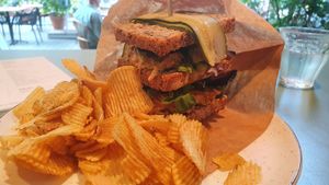 Club sandwich and crisps at SUE in Rotterdam