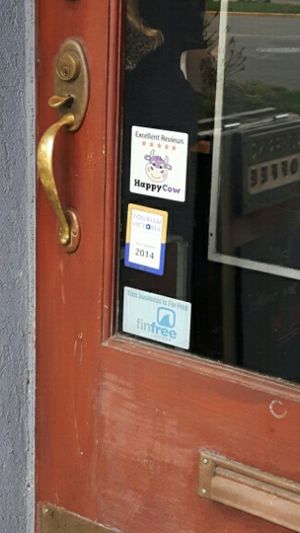 Happy Cow decal on door  at The Hot & Cold Cafe  in Victoria