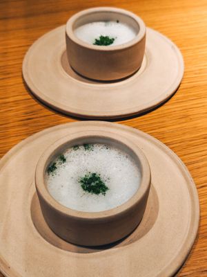 Celeriac ”chawanmushi", preserved peas and foamy celeriac velouté at Grön Restaurant in Helsinki