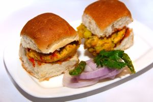 Vada Paav. A Mumbai street food made up of two parts; Vada - a mixture of Potato (boiled, mashed and tempered) coated with Chick pea flour and deep fried. Served in Dinner rolls with Garlic Chutney! at Saattveek in Auckland