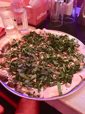 White pizza (without cheese) topped with garlic, spinach, and mushrooms at Piola in Playa Del Carmen