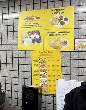 Signs on the wall at Sri Ganesh's Dosa House in Jersey City