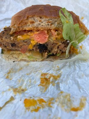 Curbside Burger (housemade patty, cheese, lettuce, tomato, pickle, special sauce at Reverie Cafe + Bar in Minneapolis