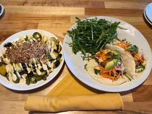 Appetizer Brussel sprouts.  Entree tacos (yummy) and arugula salad (very heavy in oil)   at Reverie Cafe + Bar in Minneapolis