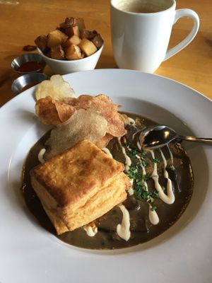 Biscuits and Gravy with a side of Fried Smoked Potatoes. Interesting & tasty mushroomy take on gravy. at Reverie Cafe + Bar in Minneapolis